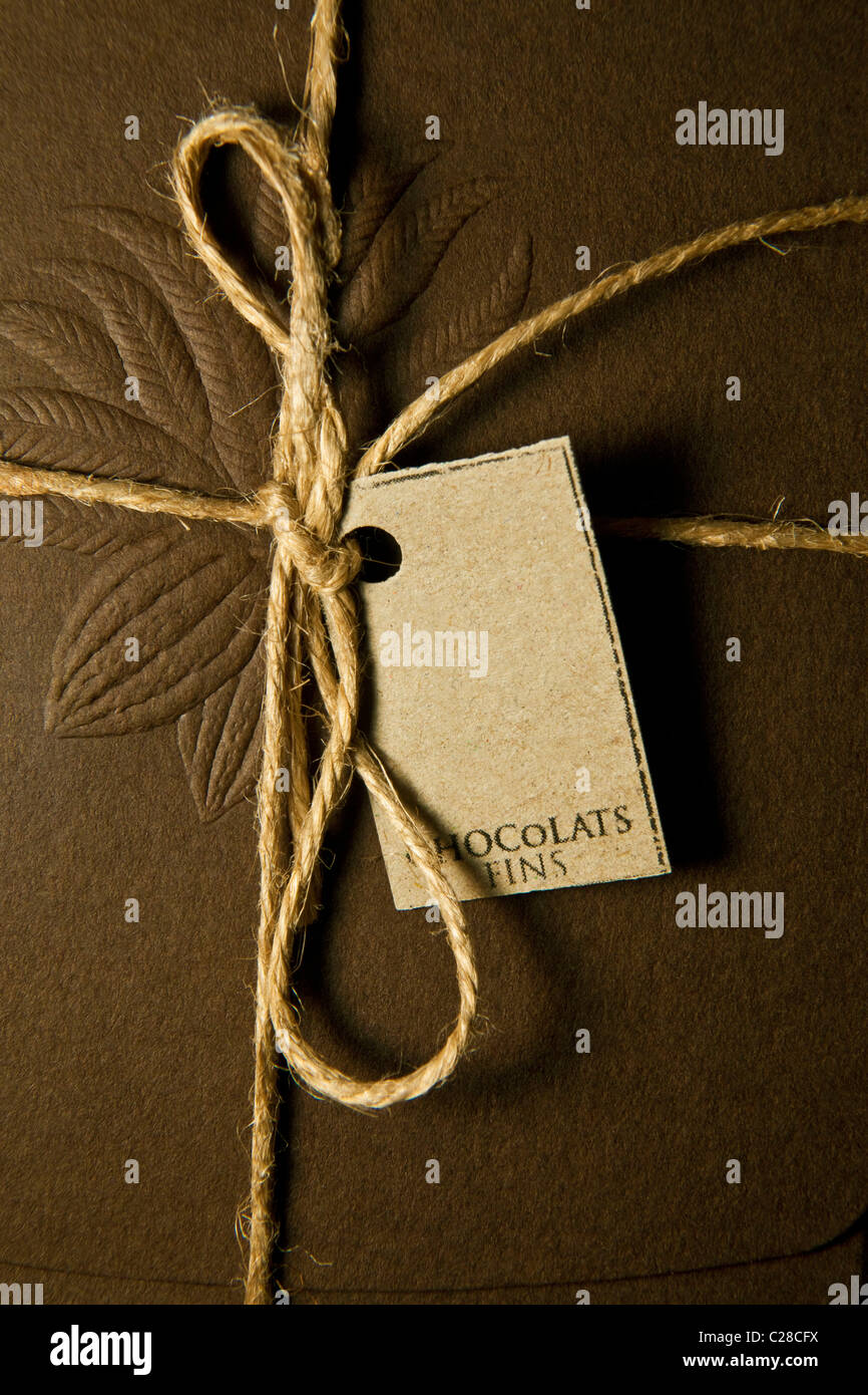 Chocolate Label and gift warpped with empty label and cocoa on on brown box. Stock Photo