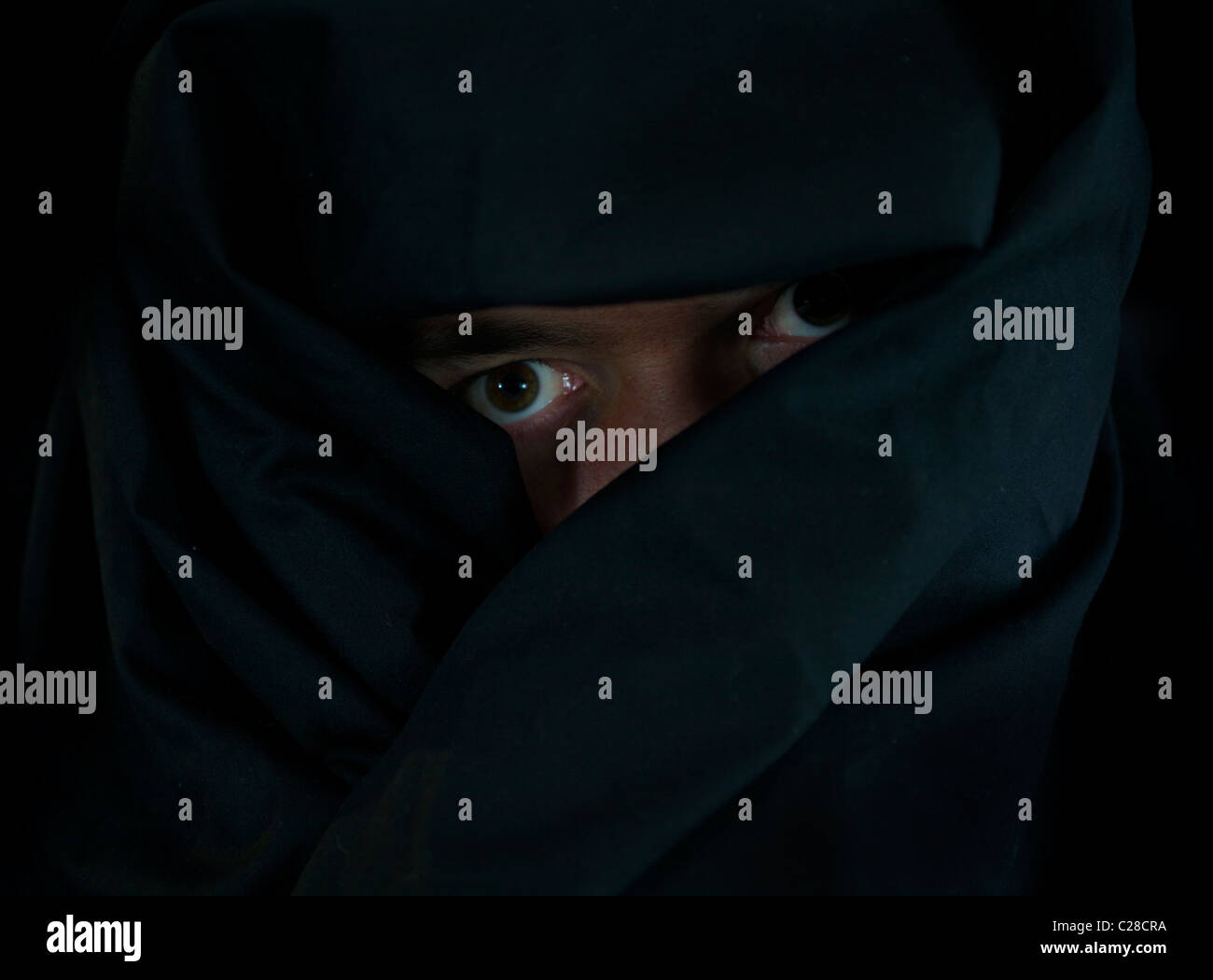 Man in black cloak with hood hi-res stock photography and images - Alamy