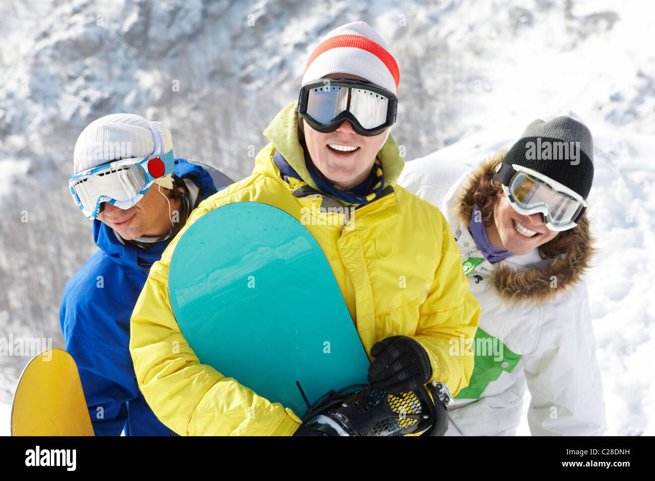 Portrait of three happy friends in googles Stock Photo