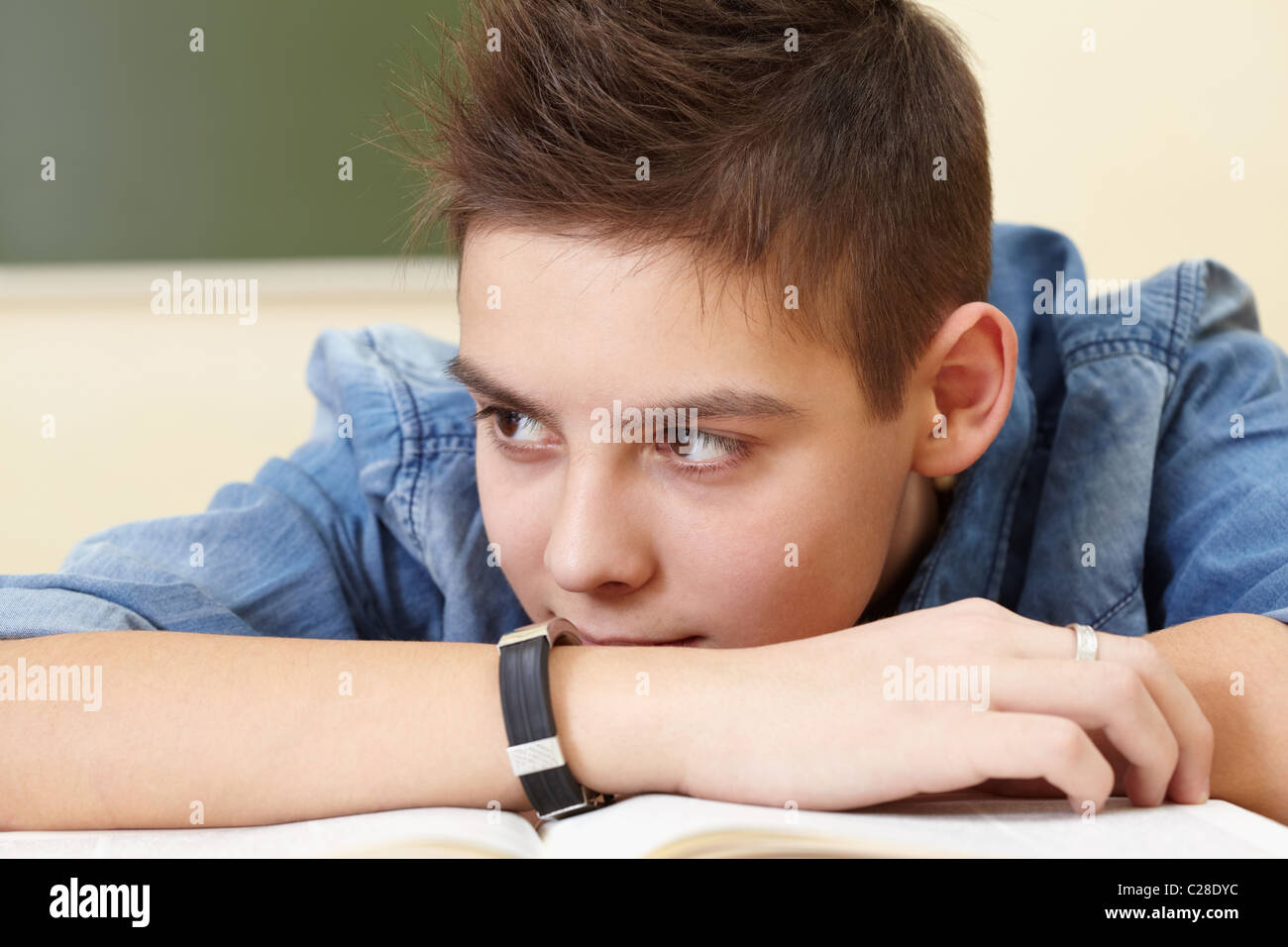 Portrait of smart lad looking aside pensively Stock Photo