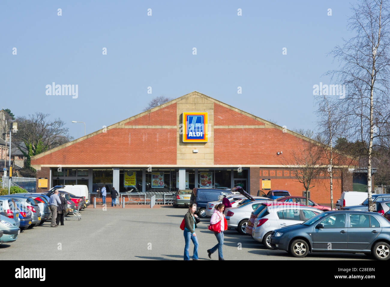 Aldi store front with cars parked in car park outside supermarket Stock