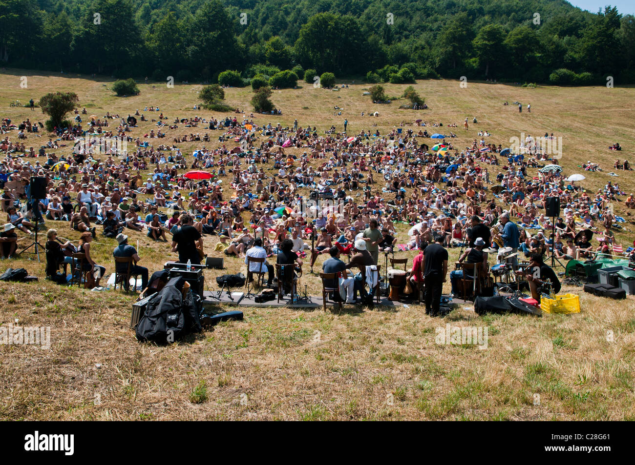 Audience gathering on a mountain for the classical music concert I Suoni delle Dolomiti, Malga Fratte, Plateau Vezzena, Levico, Stock Photo