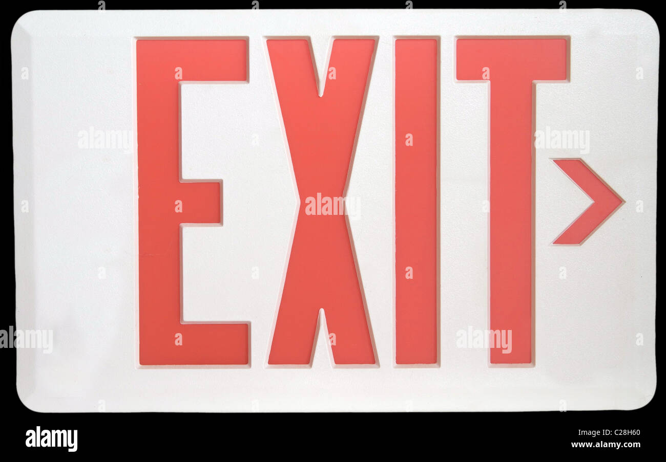 A White and Red Exit Sign Isolated on Black Stock Photo