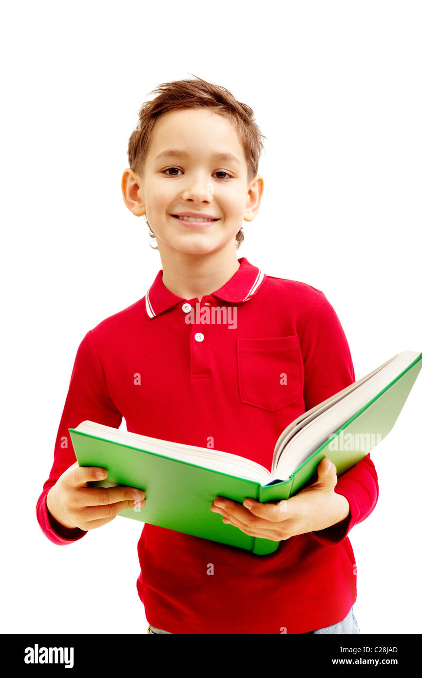 Image of cheerful little boy holding the textbook Stock Photo - Alamy