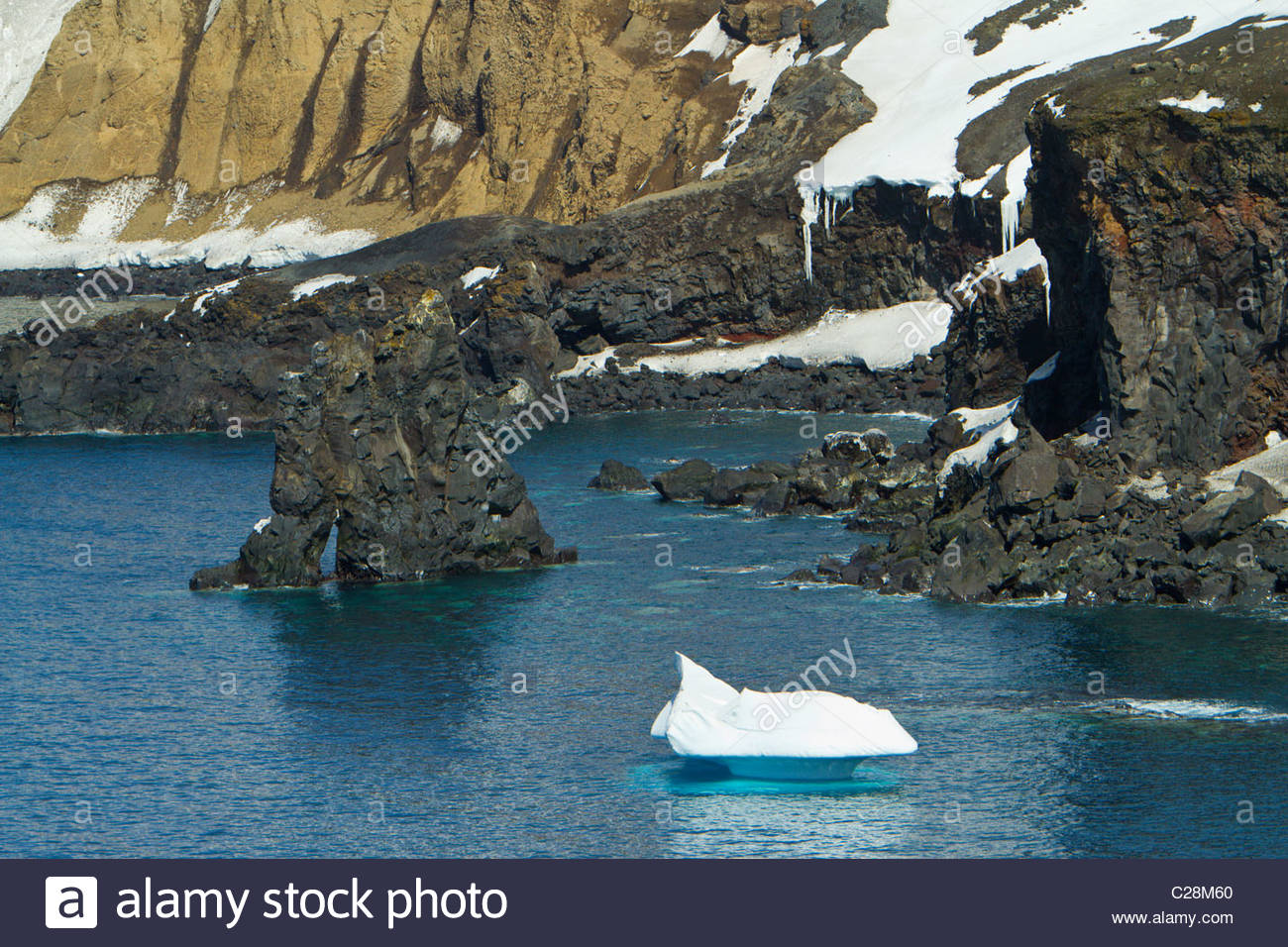 Polar Roks Ice Creem Polar scenic of an iceberg and volcanic rock Stock Photo - Alamy