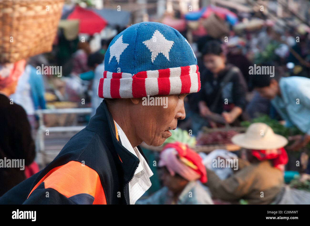 Portrait of a man with american flag hat. Zeigyo market. Mandalay. Myanmar Stock Photo