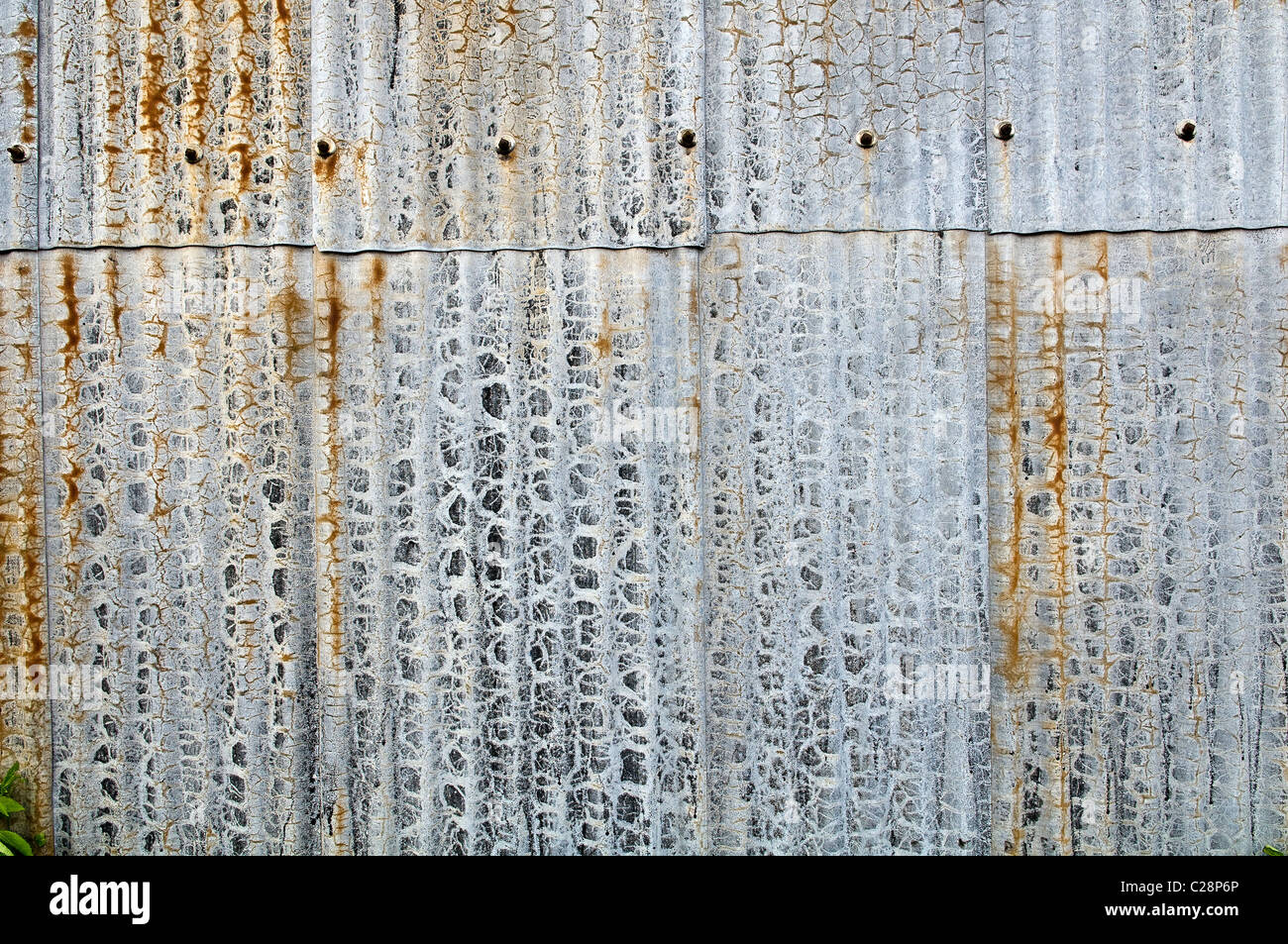 Interesting patterns on the side of a corrugated steel barn Stock Photo