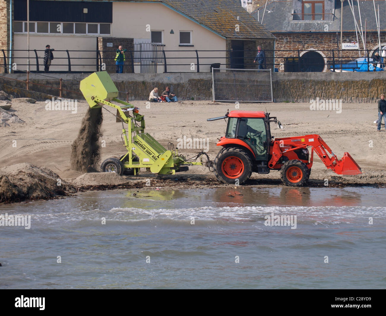 Barber Surf Rake, Working on Looe Beach, Cornwall, UK Stock Photo Alamy