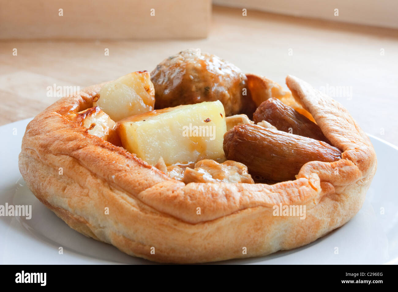 Yorkshire pudding with a traditional chicken roast dinner inside Stock