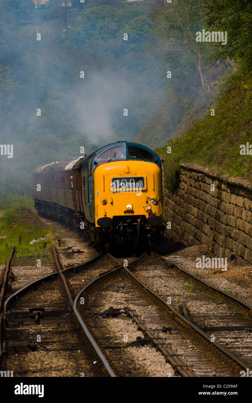 A diesel pulling steam train carriages along the North