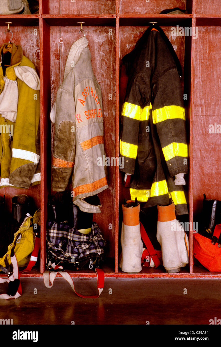 Fireman’s gear and equipment hanging in lockers in a fire house Stock