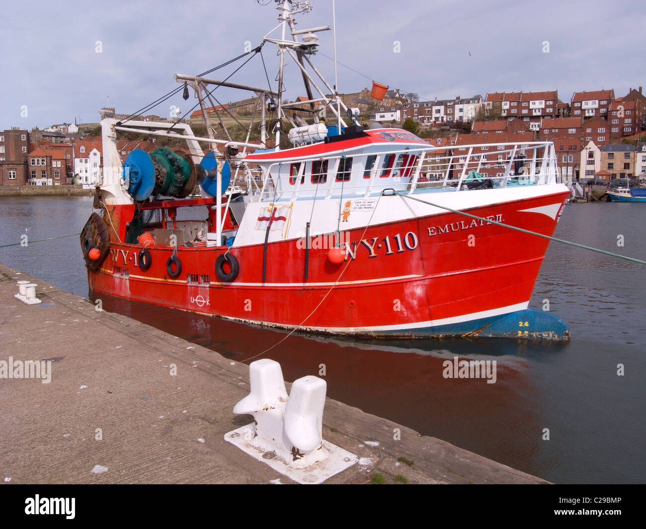 Red fishing boat 'Emulate ll' at Endeavour quay Whitby, North Yorkshire. Stock Photo