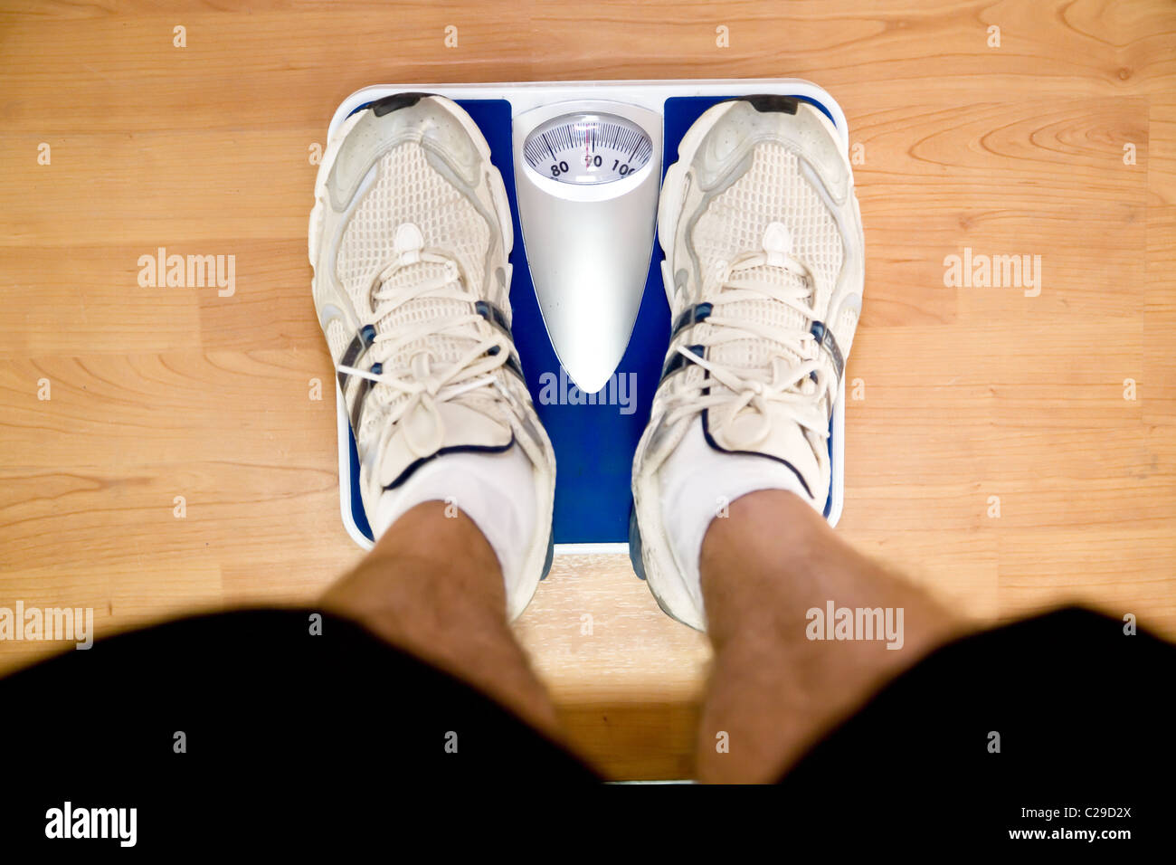 perspective view looking down at a set of weighing scales in a gym with