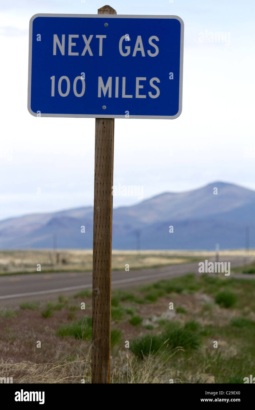 Next gas 100 miles road sign at the Oregon/Nevada border in McDermitt, USA. Stock Photo