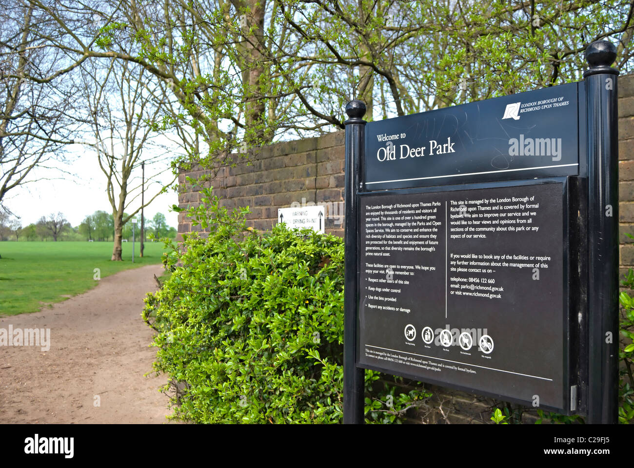 information board by an entrance to old deer park, richmond upon thames