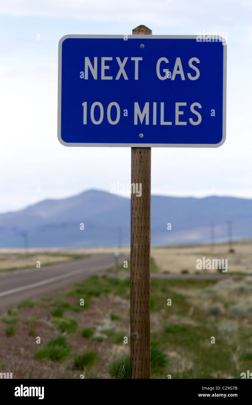 Next gas 100 miles road sign at the Oregon/Nevada border in McDermitt, USA. Stock Photo