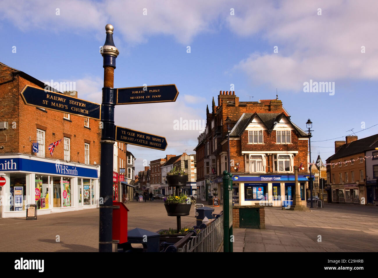 Direction sign and shops on a quiet Sunday afternoon in the Market