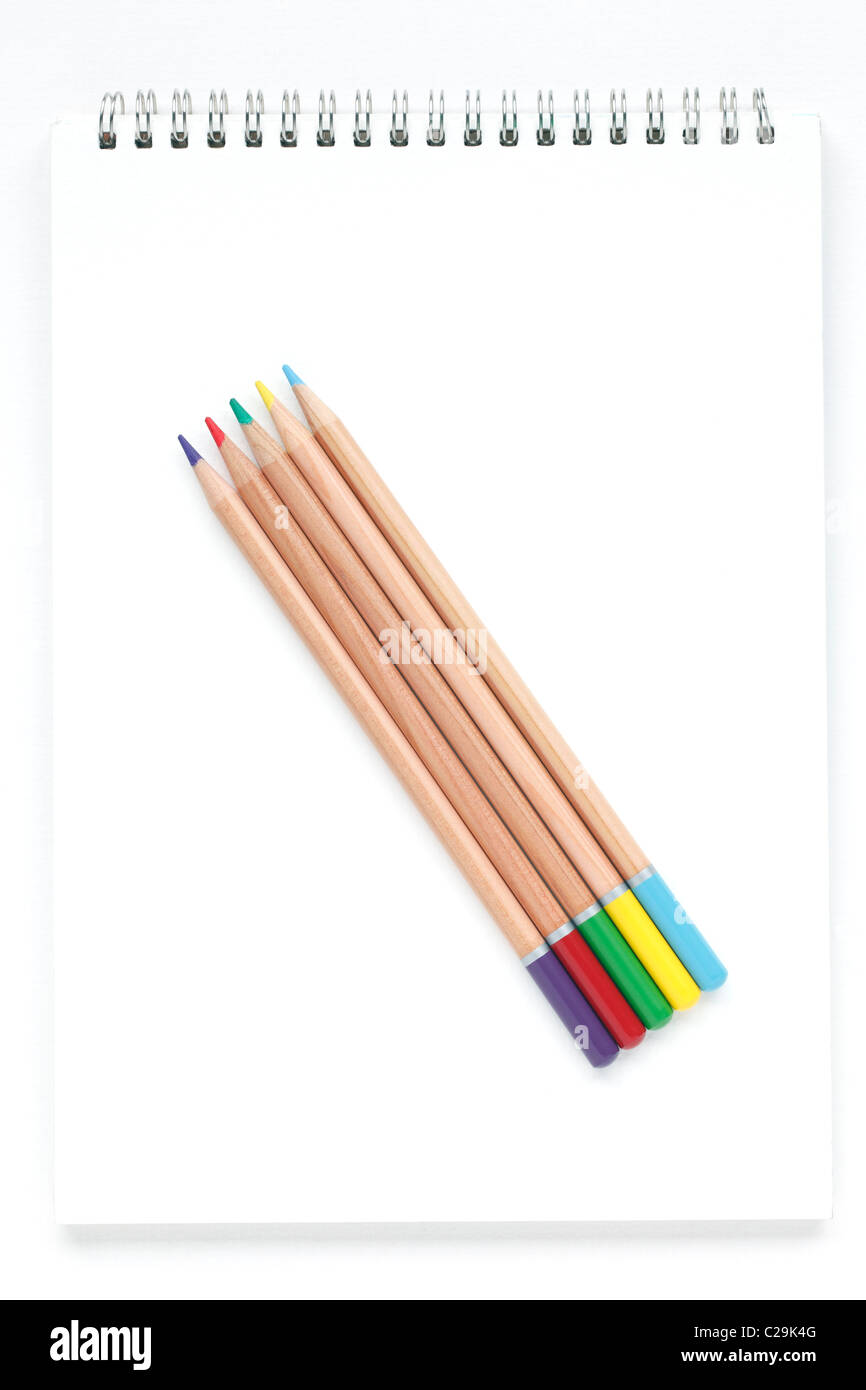 Colour pencils on a drawing pad Stock Photo