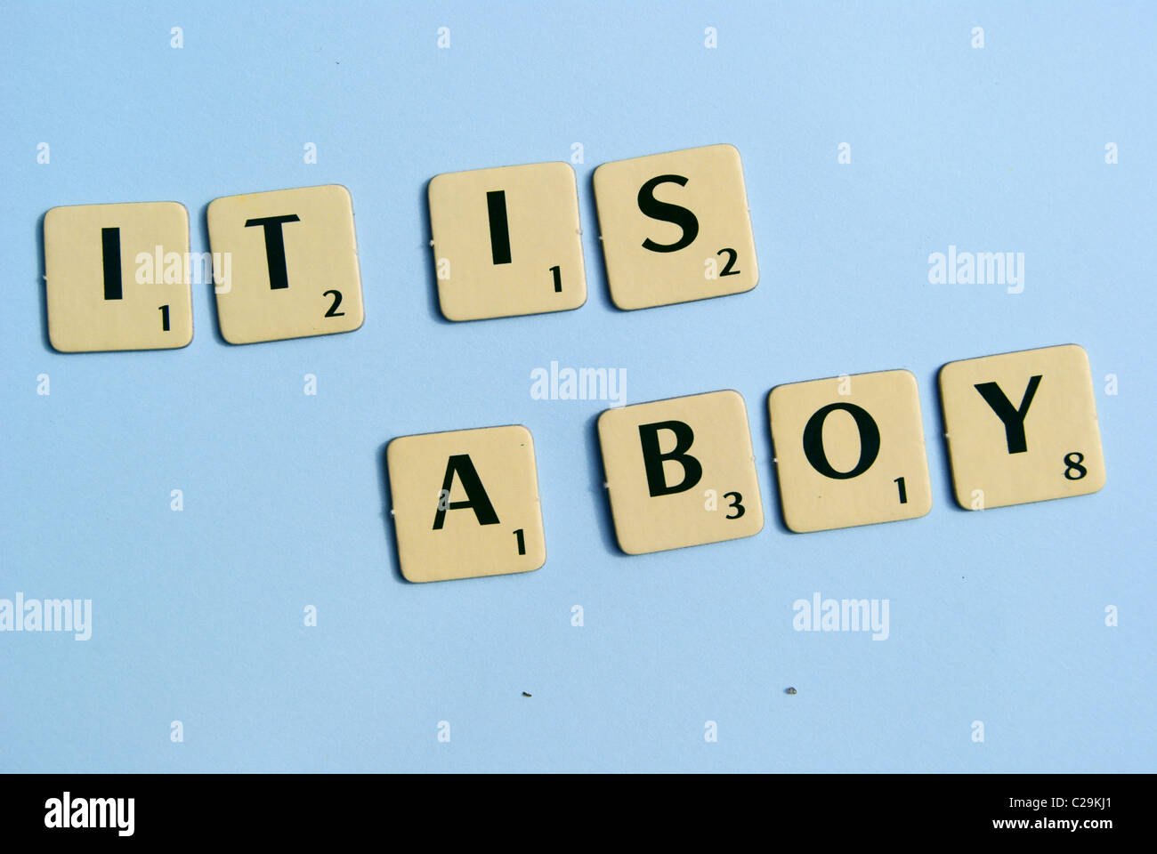 Scrabble letters spelled It is a boy Stock Photo