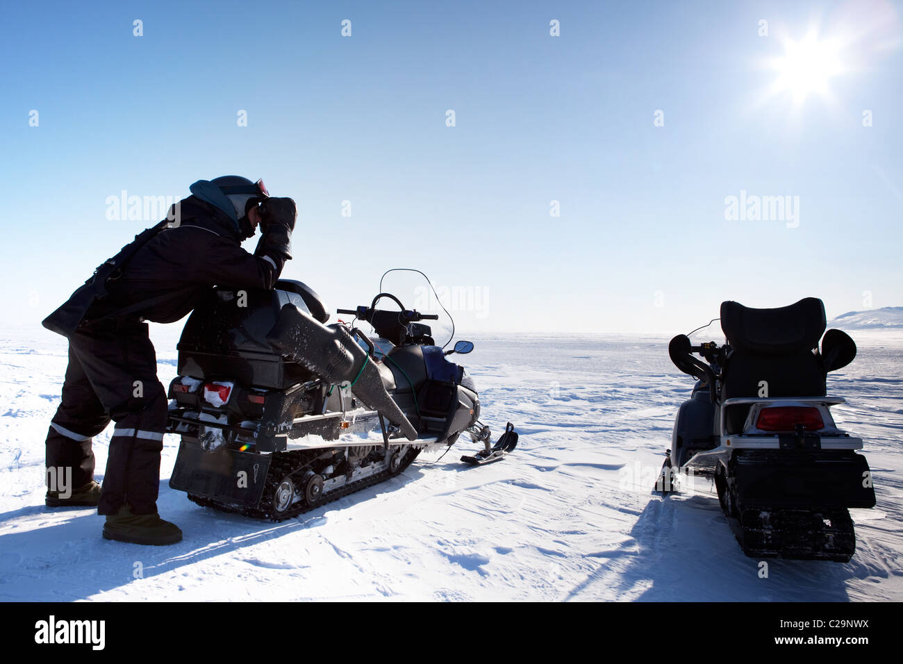 An expedition guide on the look out for polar bears - Svalbard Norway Stock Photo