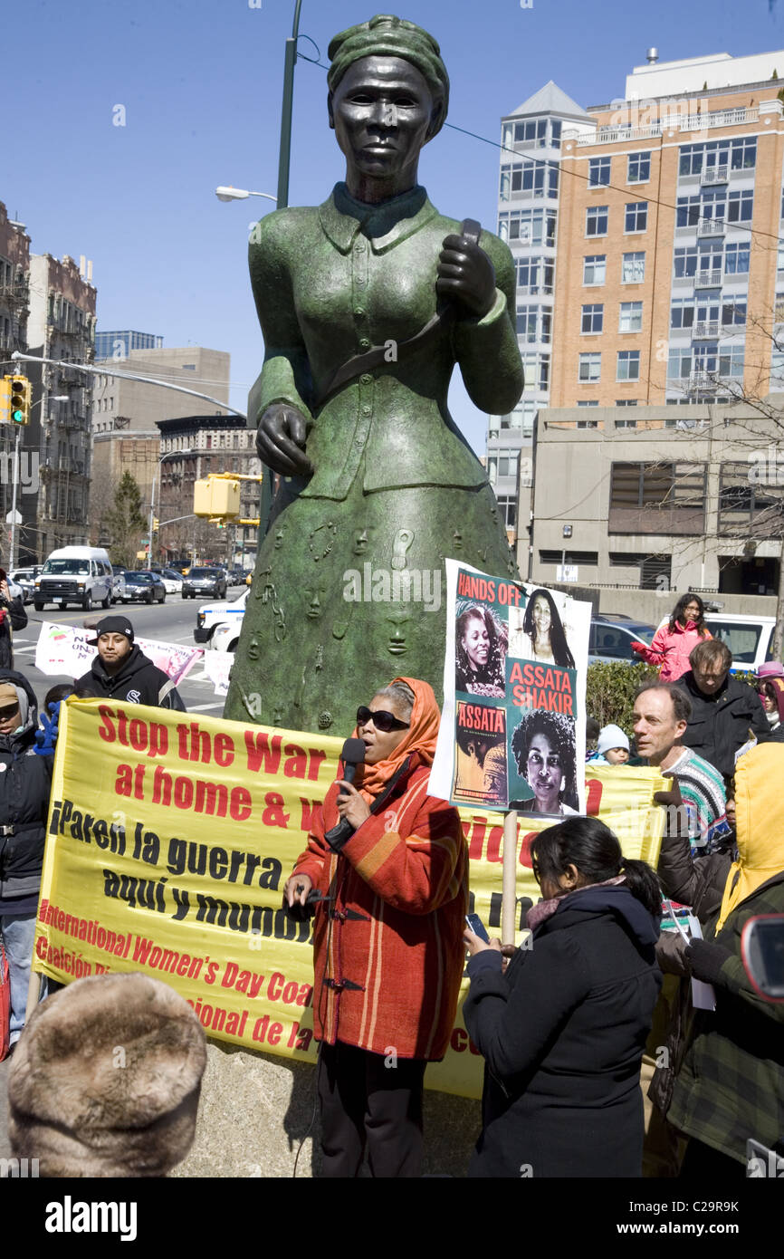 Women rally during International Womens Month at Harriet Tubman Memorial Place in Harlem, New York City. Stock Photo