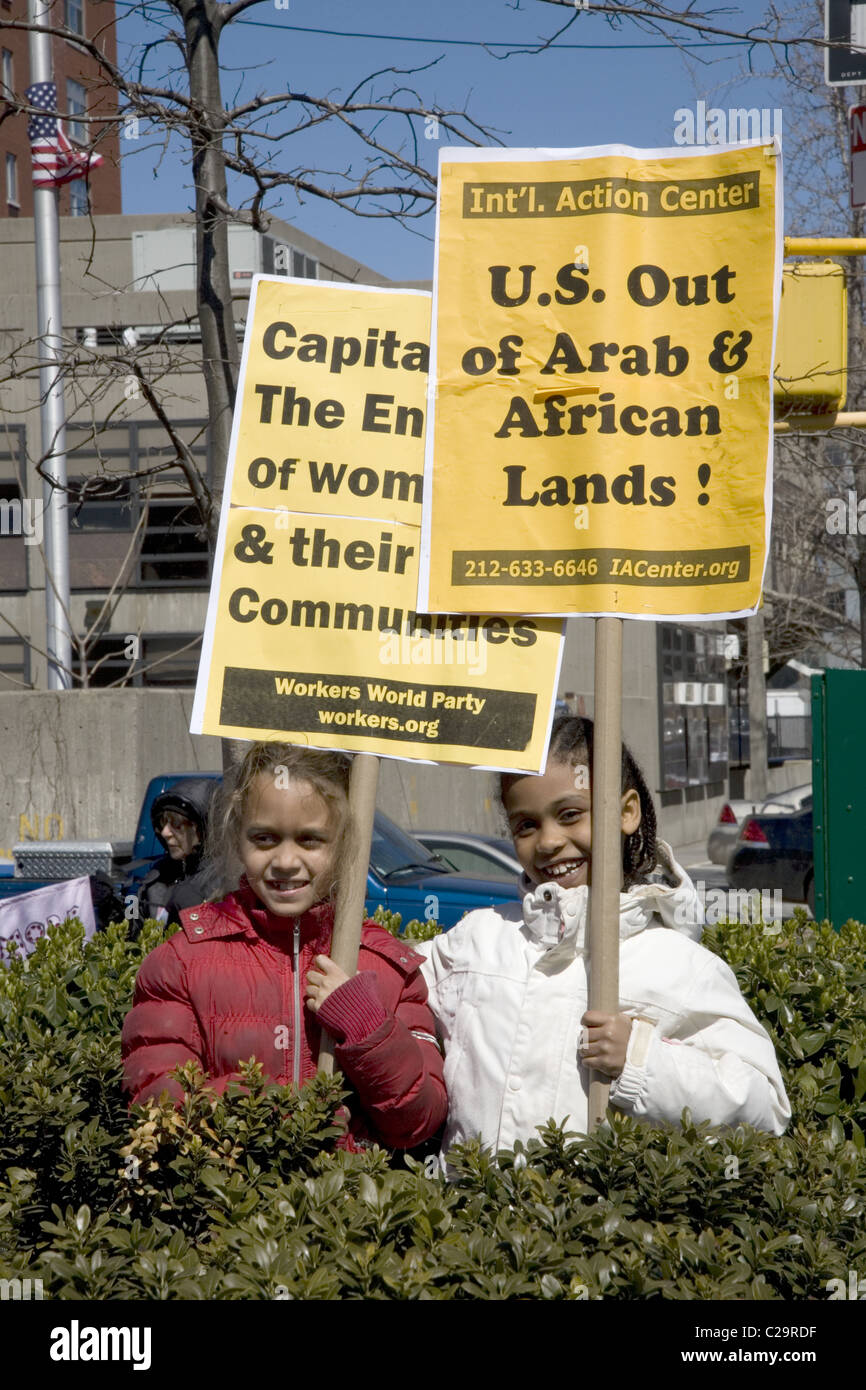 Women rally during International Womens Month at Harriet Tubman Memorial Place in Harlem, New York City. Stock Photo