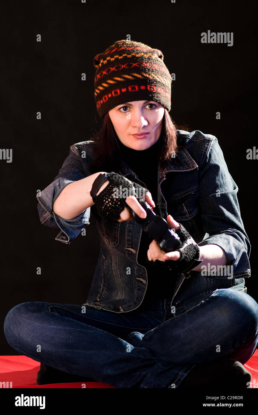 woman gamer with joystick on dark background Stock Photo