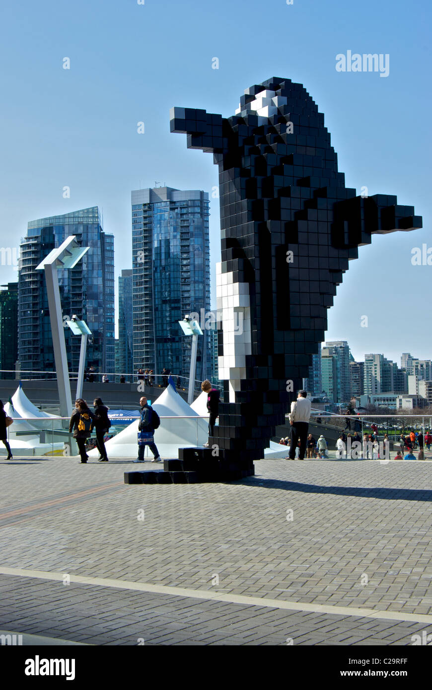 Stylized Doug Coupland Pixel Orca sculpture Jack Poole Plaza with backdrop Vancouver waterfront high rise residential towers Stock Photo