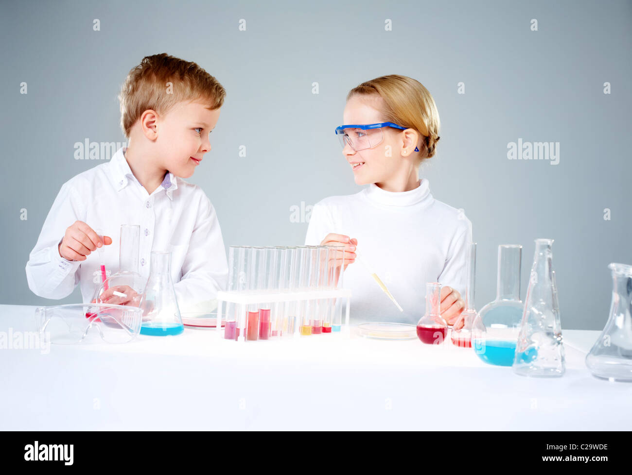 A girl and a boy making scientific experiments Stock Photo