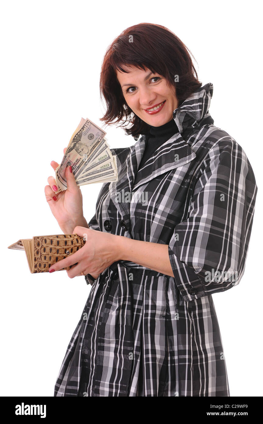 The woman holds in hands a purse and money isolated on white background Stock Photo