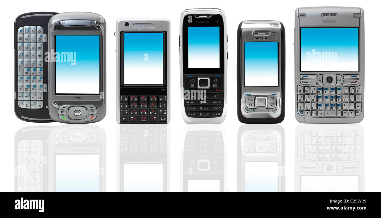 5 different 2008 mobile phones in a line standing up on white