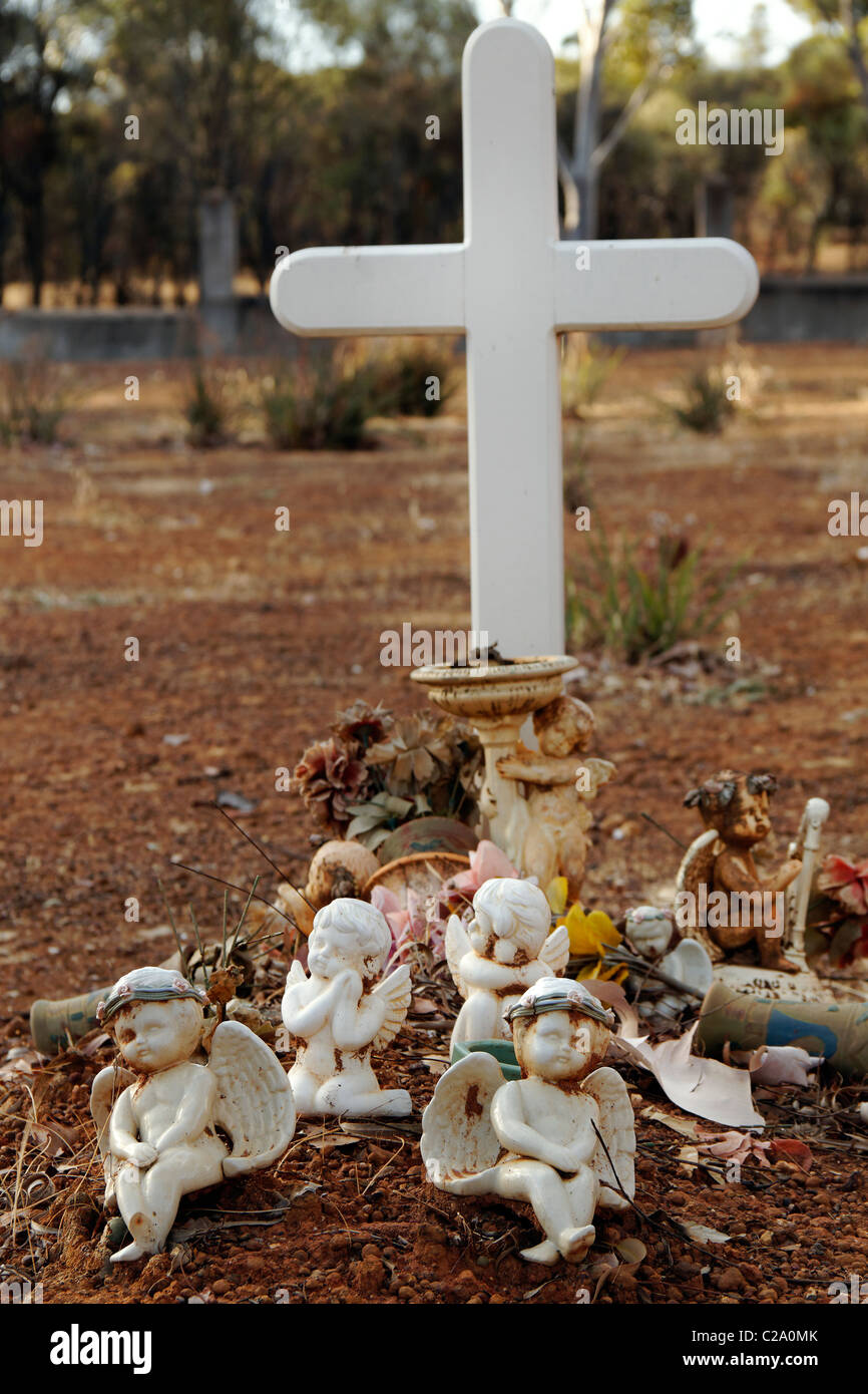 Grave with white cross and angels, New Norcia Western Australia Stock Photo