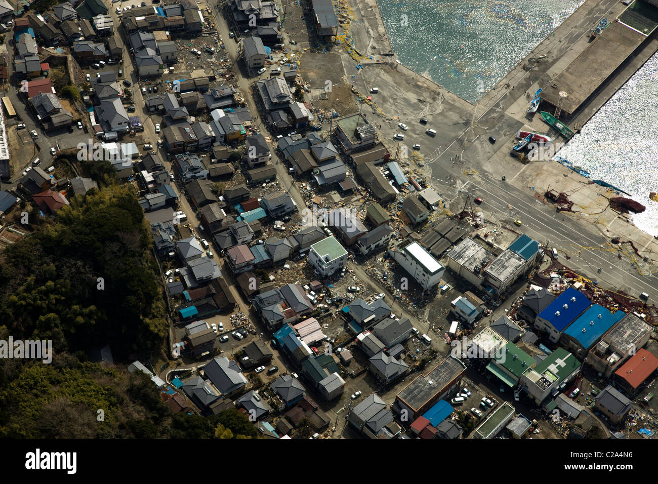 Aerial photo taken March 13 2011 of damage to Otsu Port and residential area, Kitaibaraki, Ibaraki Prefecture, Japan, showing Stock Photo