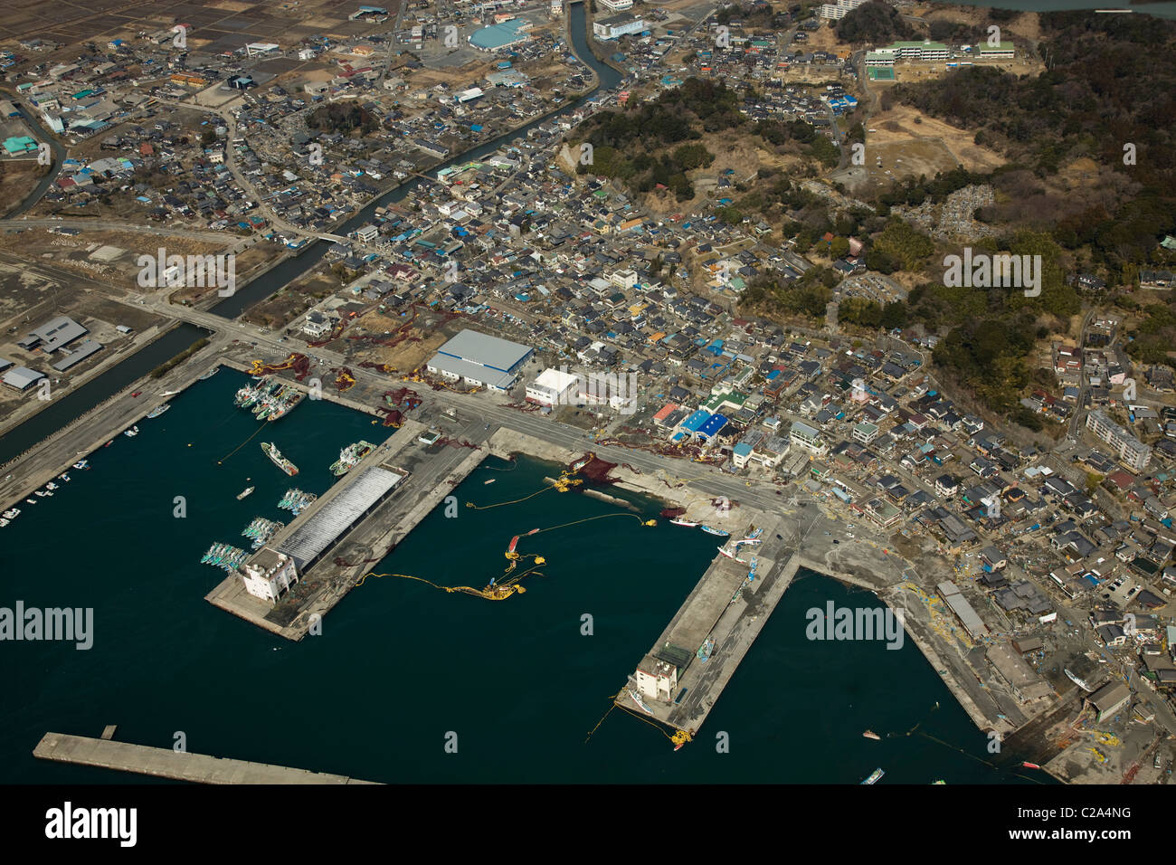 Aerial photo taken March 13 2011 of damage to Otsu Port and residential area, Kitaibaraki, Ibaraki Prefecture, Japan, showing Stock Photo