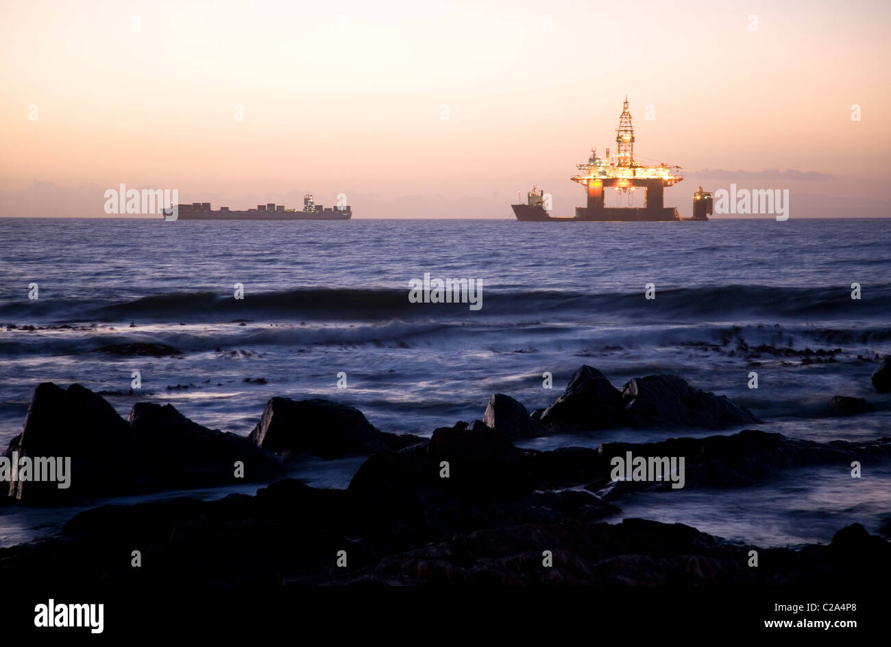 Illuminated Oil Rig Off shore in Cape Town Stock Photo