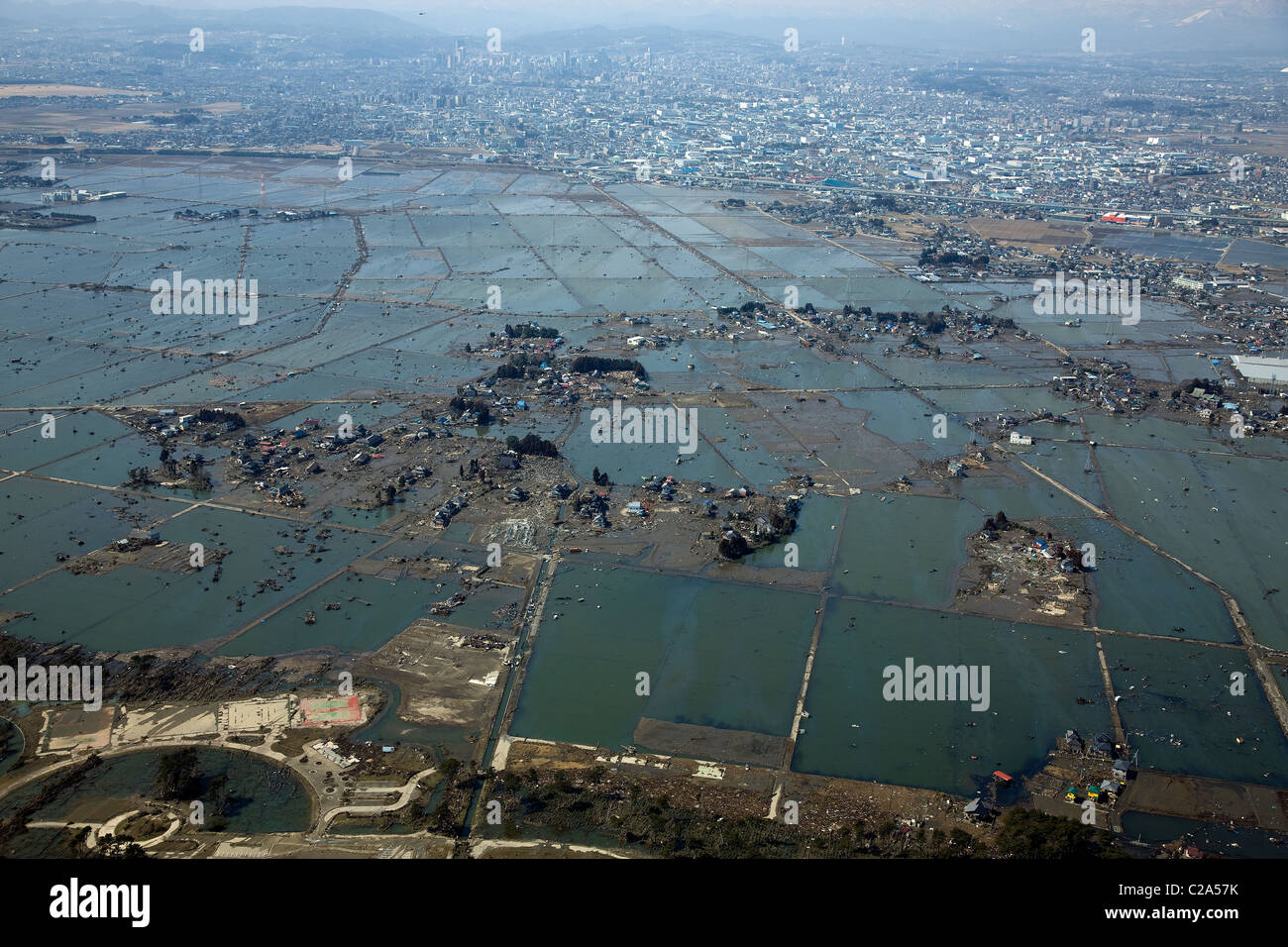 Aerial view of damage to Sendai, Miyagi Prefecture after a 9. 0 magnitude earthquake and subsequent tsunami devastated the area Stock Photo