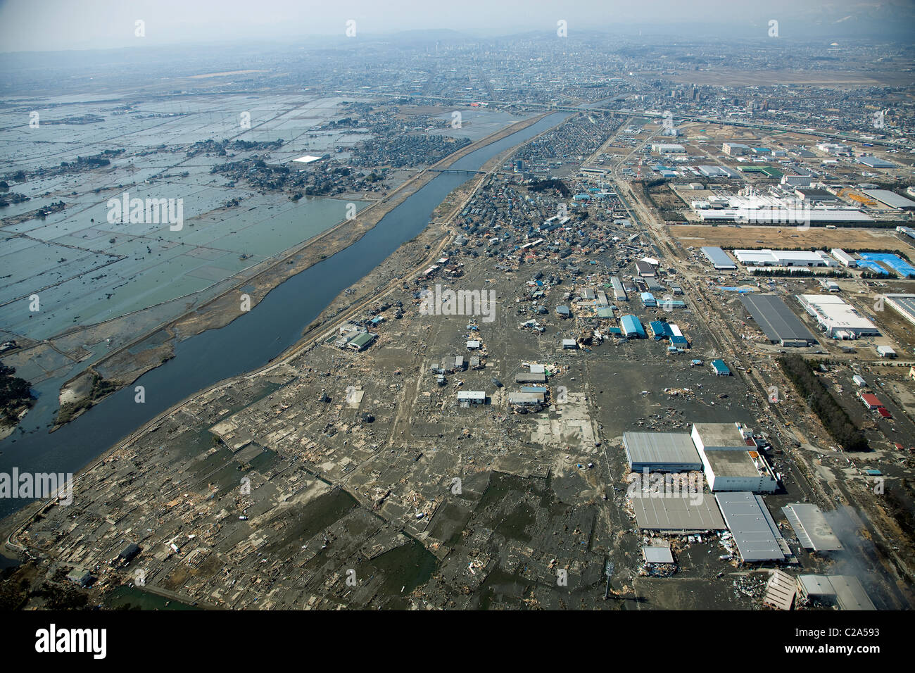 Aerial view of the devastation caused by the earthquake and tsunami in Sendai, Miyagi Prefecture after a 9. 0 magnitude Stock Photo