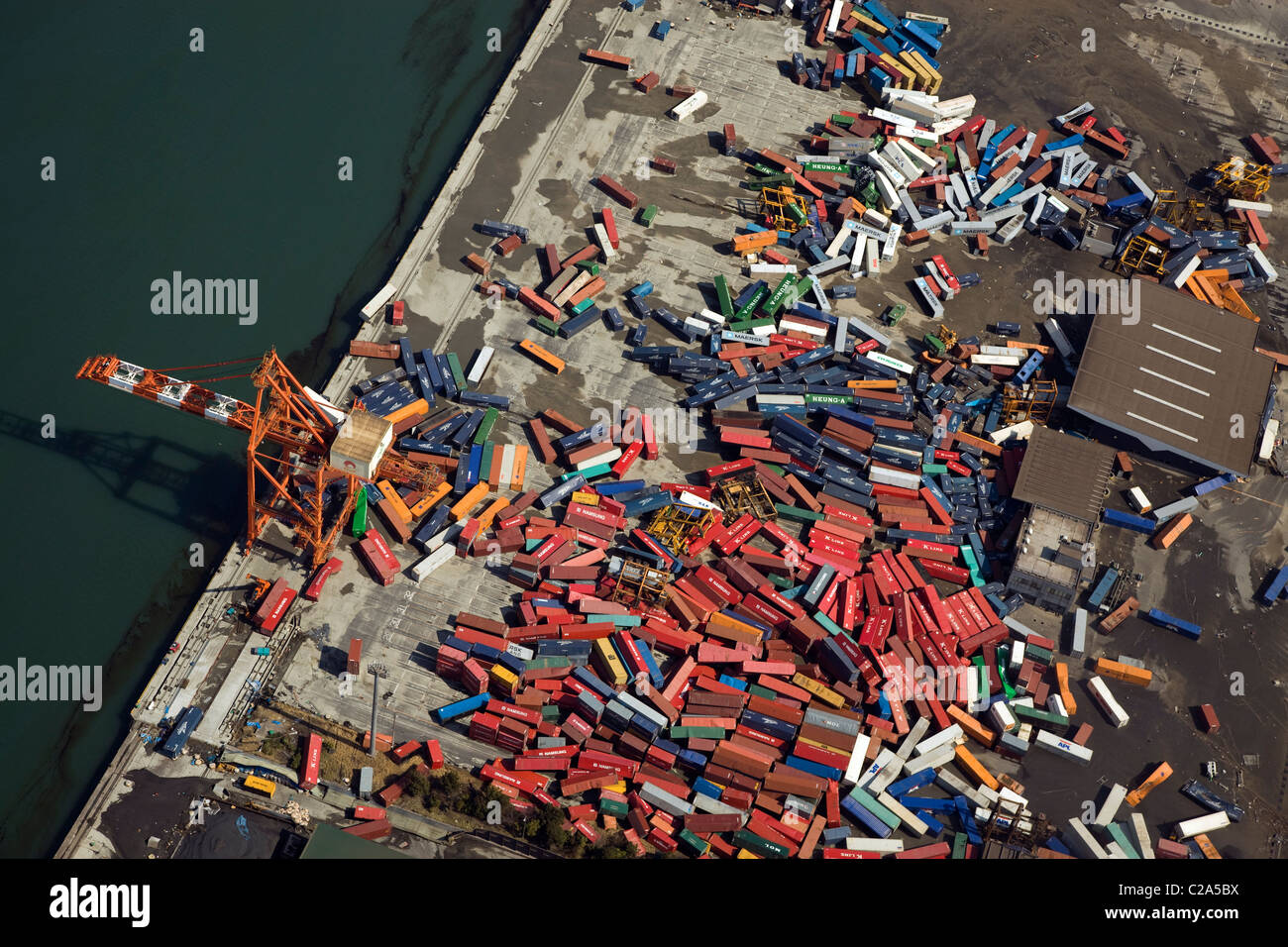 Aerial view of damage to container terminal in Sendai Shiogama Port, Miyagi Prefecture after a 9. 0 magnitude earthquake and Stock Photo