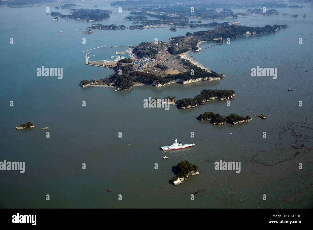 Aerial view of oil spilled Matsushima Bay and stranded ship in Shiogama, Miyagi Prefecture after a 9. 0 magnitude earthquake Stock Photo