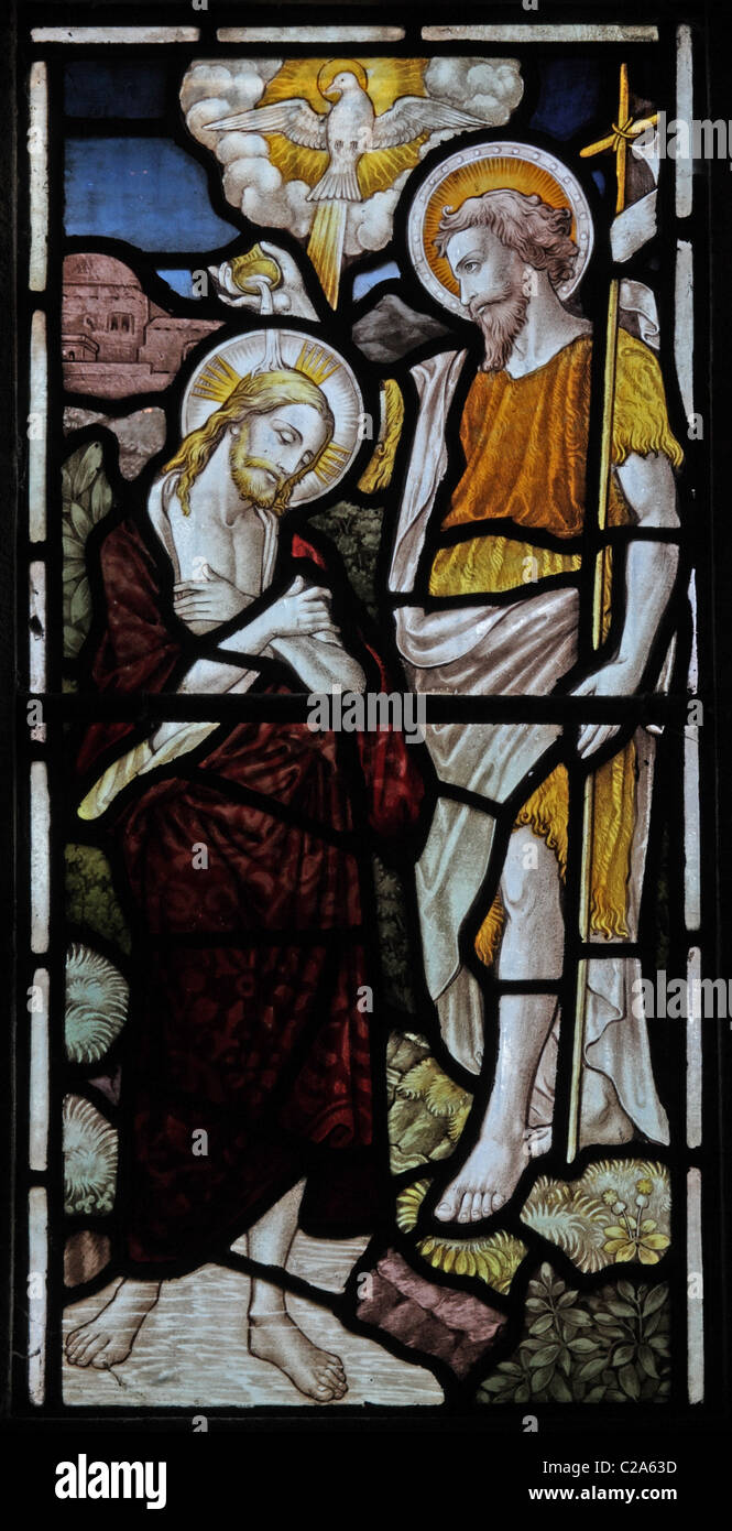 A stained glass window by Heaton Butler and Bayne depicting the baptism of jesus, All Saints Church, Watermillock, Cumbria Stock Photo
