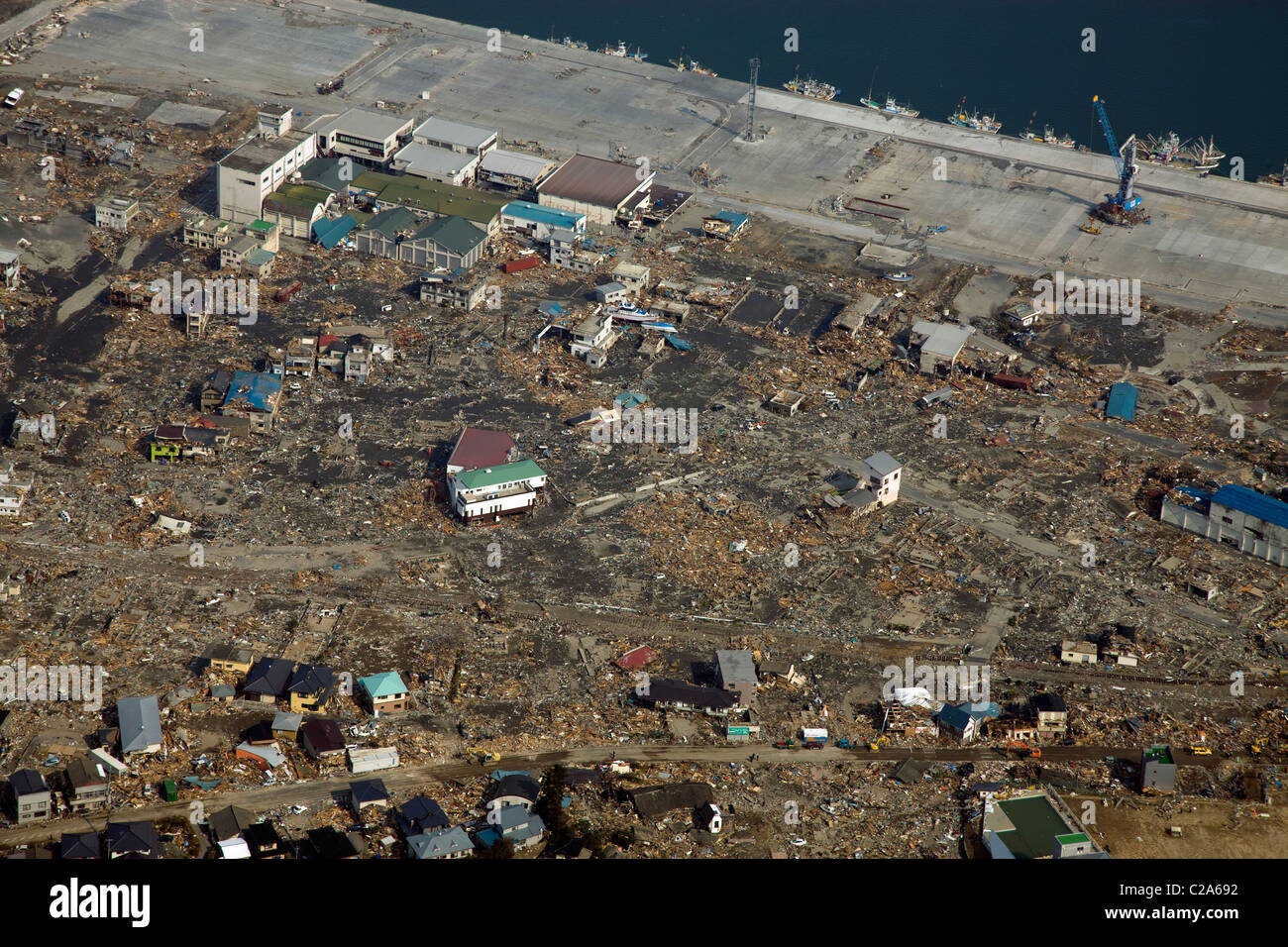Aerial view of shattered homes and other debris that was swept inland by the tsunami that followed the March 11 magnitude 9 Stock Photo