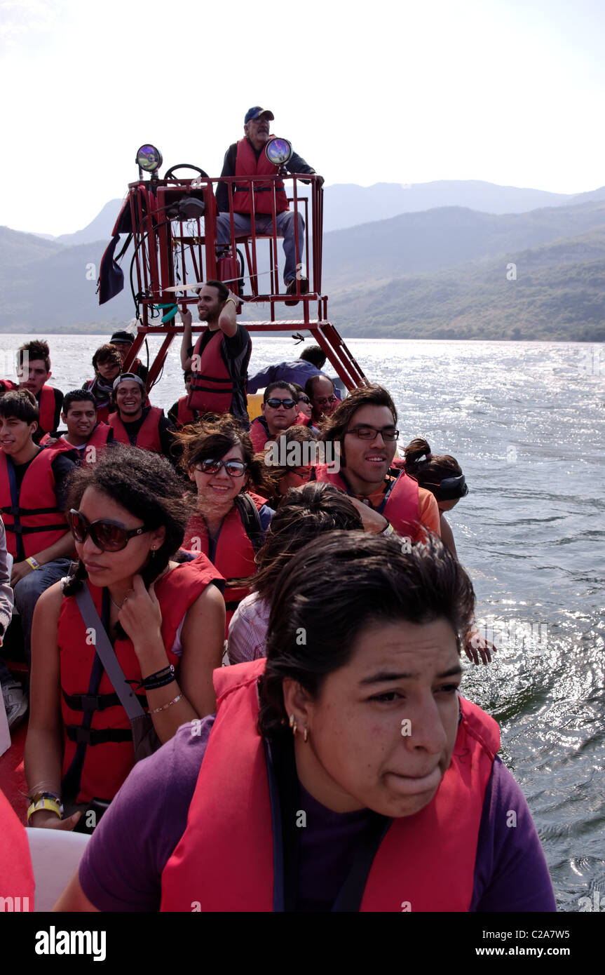 Group of tourists in a boat over Grijalva river which crosses the Sumidero Canyon Stock Photo