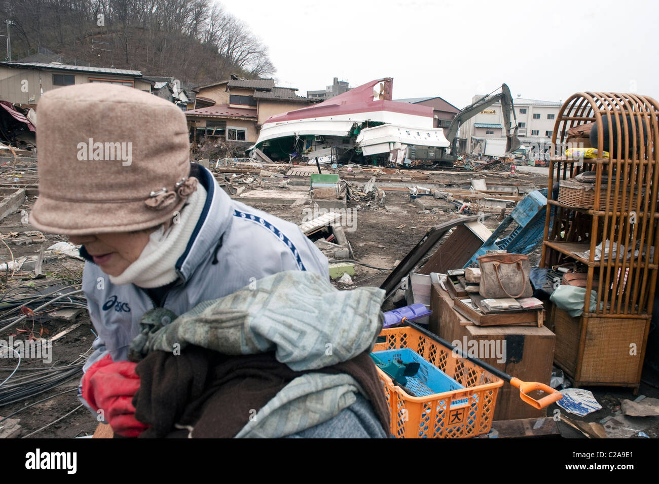 Survivors of the Tsunami start clearing up the mess after a 9.0 Mw earthquake triggered a Tsunami in the town of Miyako, Iwati Stock Photo