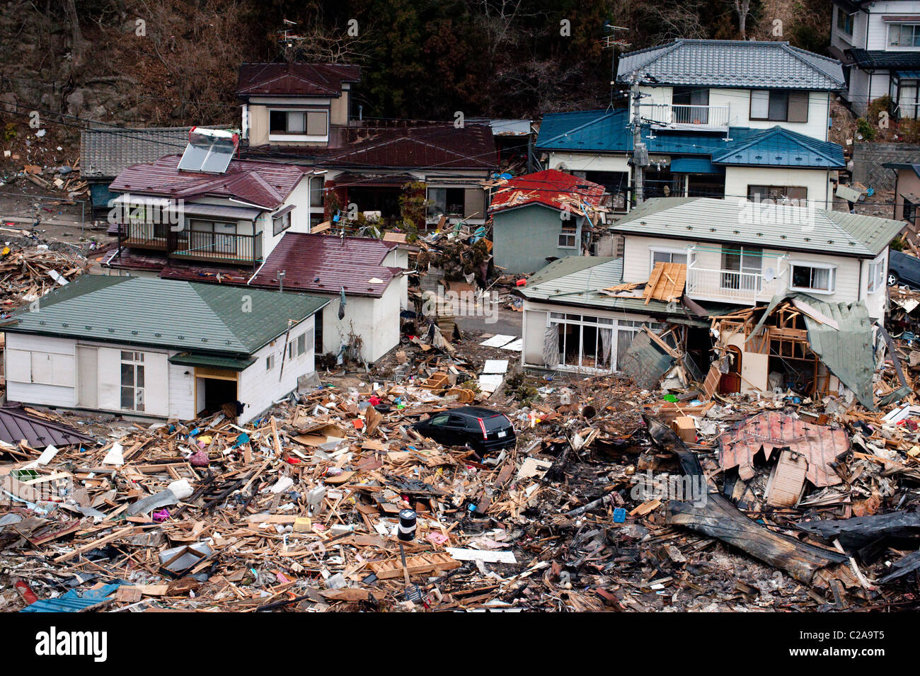 Fishing boats, cars and houses were completely destroyed after a 9.0 Mw earthquake triggered a Tsunami in the town of Yamada, Stock Photo
