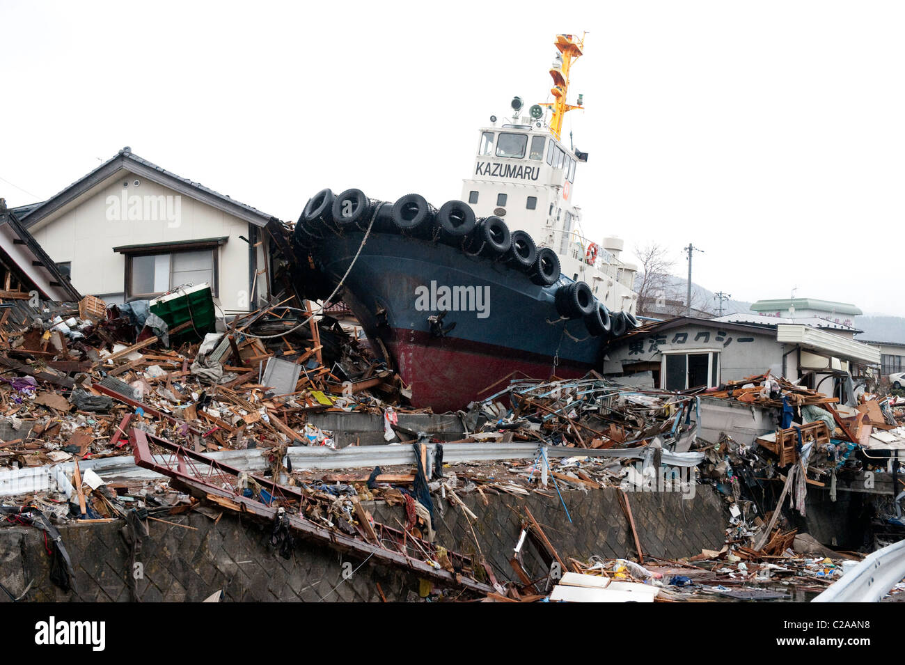 A Tug Boat Sits In A Housing Estate 5km From The Sea After A 9 0 Mw Earthquake Triggered A Tsunami In The Town Of Ofunato Iwati Stock Photo Alamy