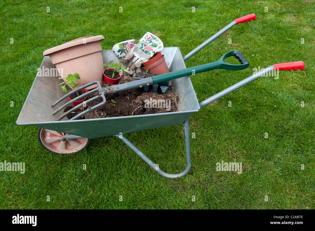 Wheelbarrow and garden tools Stock Photo Alamy