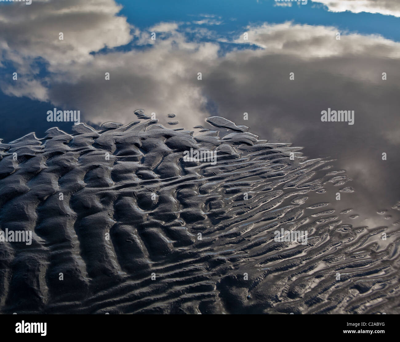 Mirror image, clouds, black sands, water Stock Photo