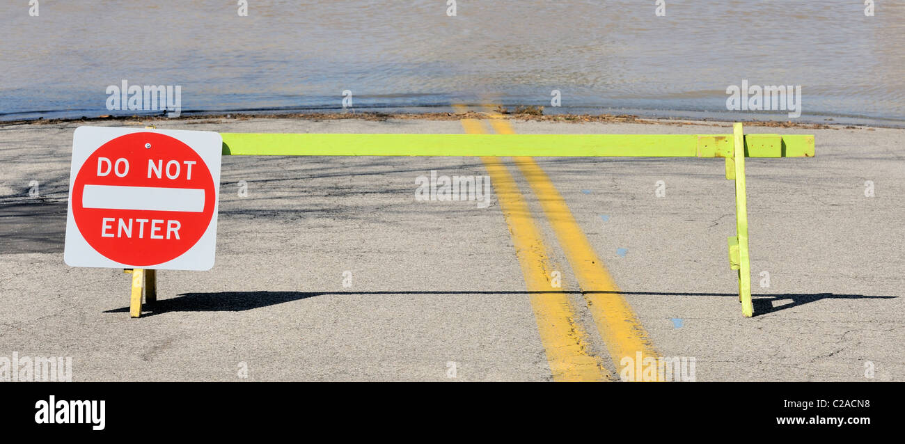 Closeup on flooded road and 'do not enter' sign Stock Photo Alamy