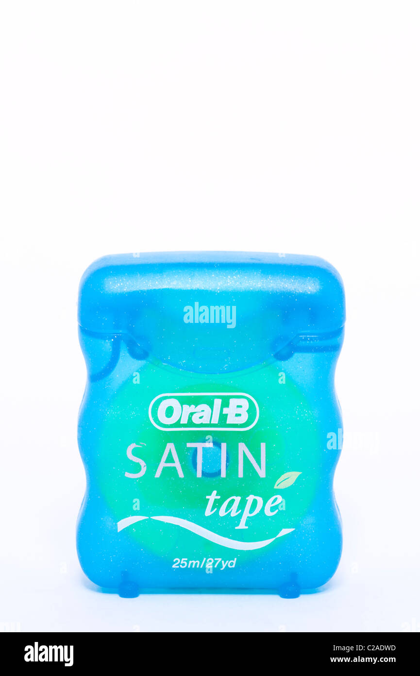 A packet of Oral-B satin tape dental floss on a white background Stock Photo