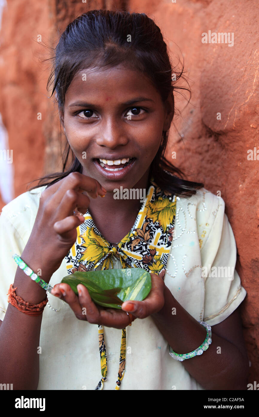 Indian girl eating honey Andhra Pradesh South India Stock Photo - Alamy